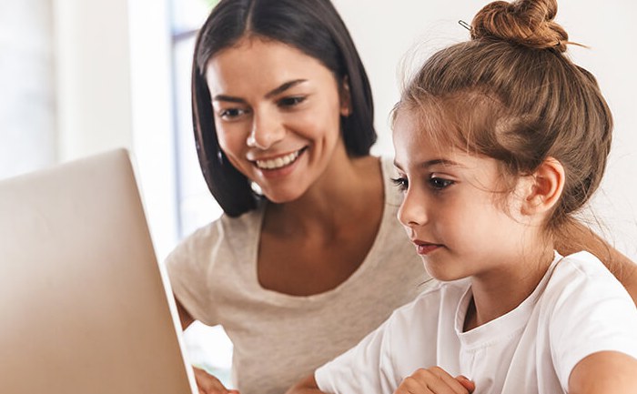 mother and daughter using a laptop