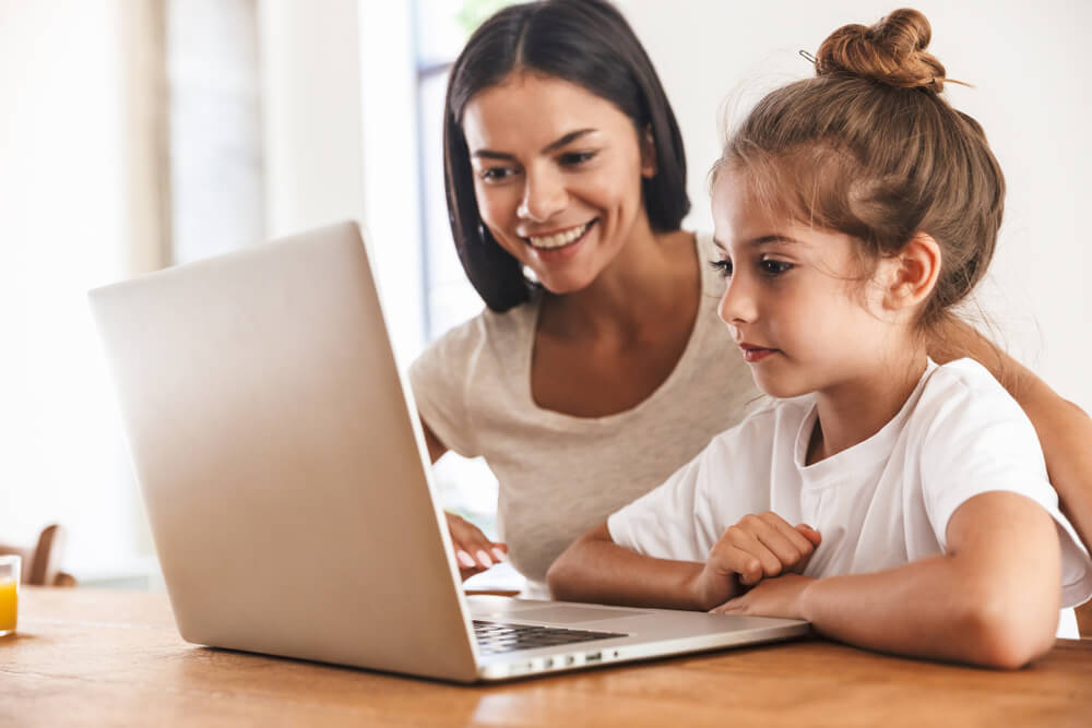 mother and child using laptop